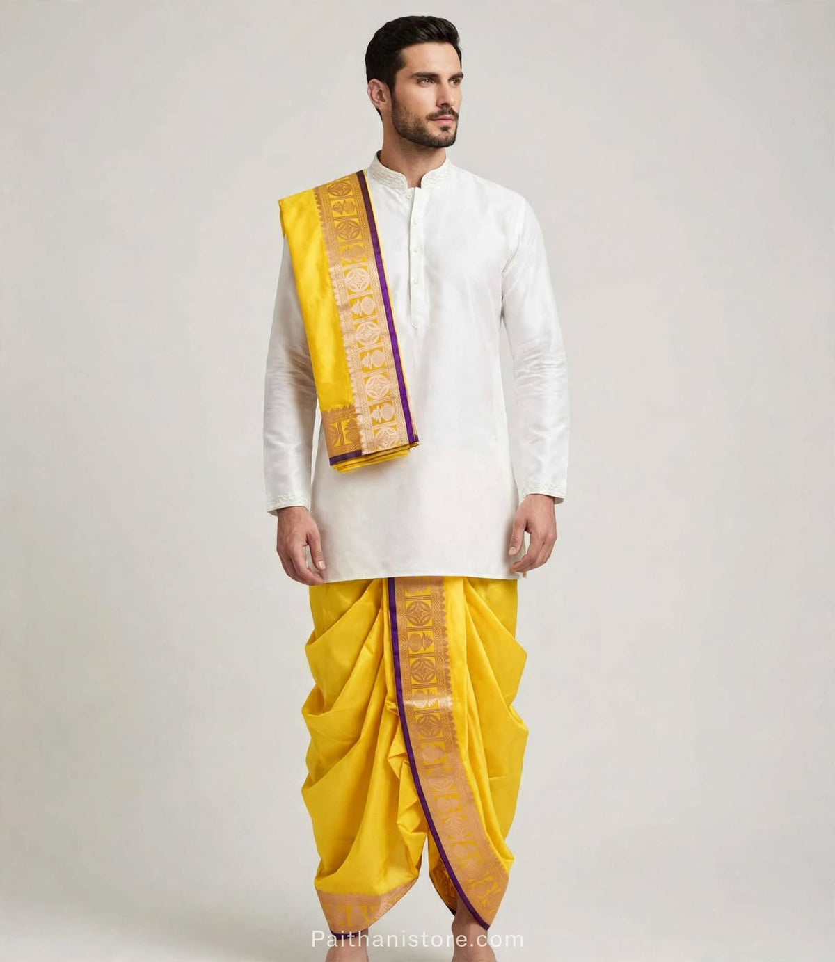 Yellow ready to wear dhoti for men with gold woven border and matching shela, worn with a white kurta
