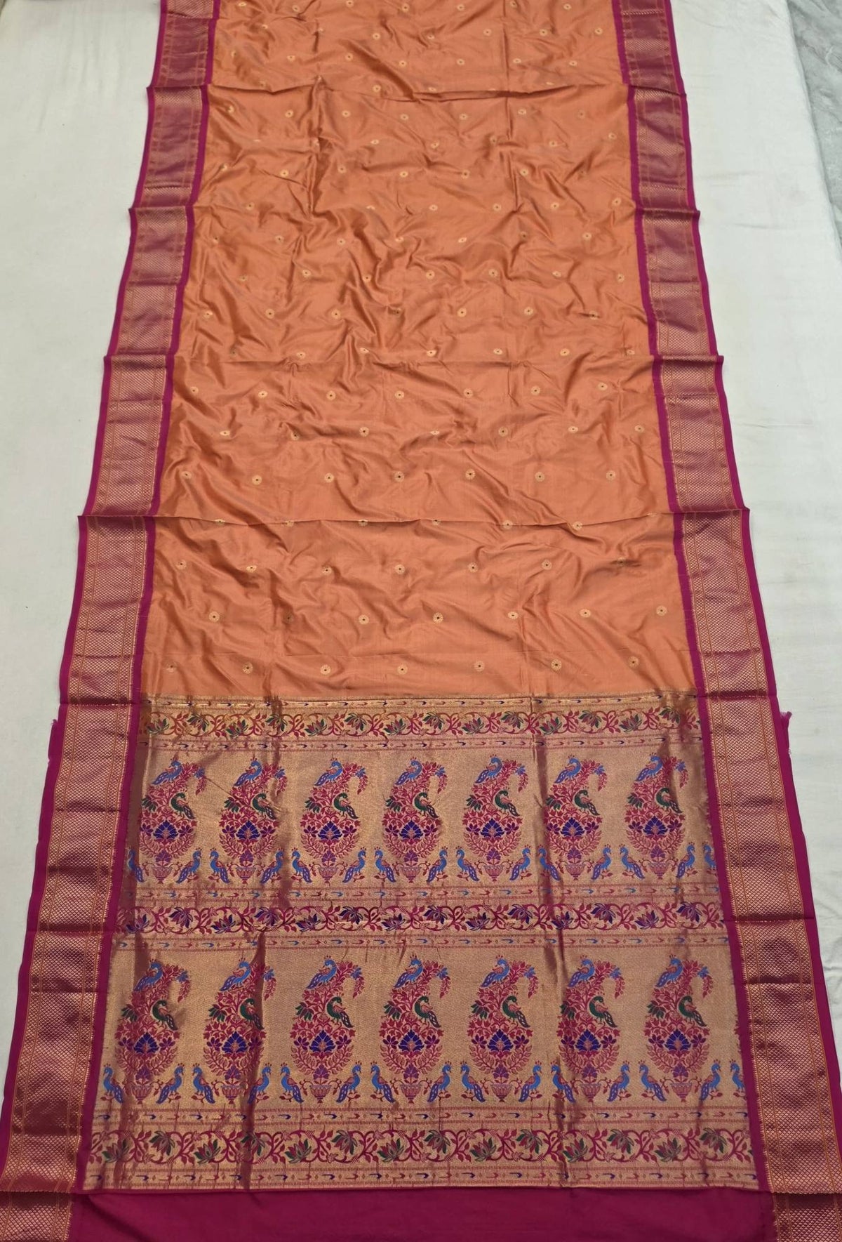Peach 9 yard silk Paithani Nauvari saree with rani pink border, shoulder butta and peacock pallu