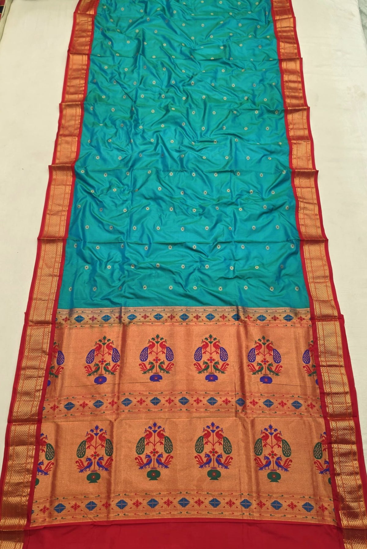 Rama Green 9 yard silk Paithani Nauvari saree with red border, shoulder butta and peacock pallu