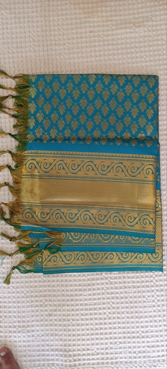 Peacock Blue Paithani Shela with gold scroll-wave pallu and leaf weave