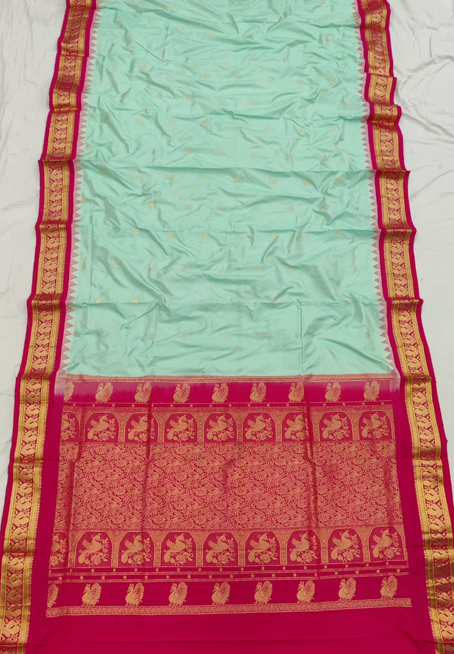 Mint green silk Gadwal saree with rani pink border, peacock pallu and all-over butta - second view
