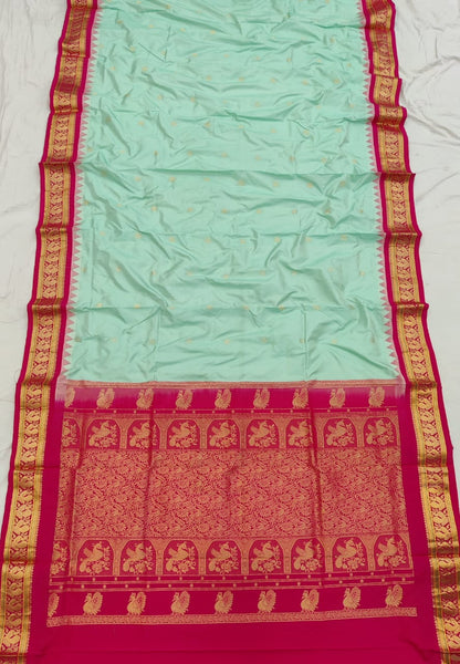 Mint green silk Gadwal saree with rani pink border, peacock pallu and all-over butta - second view