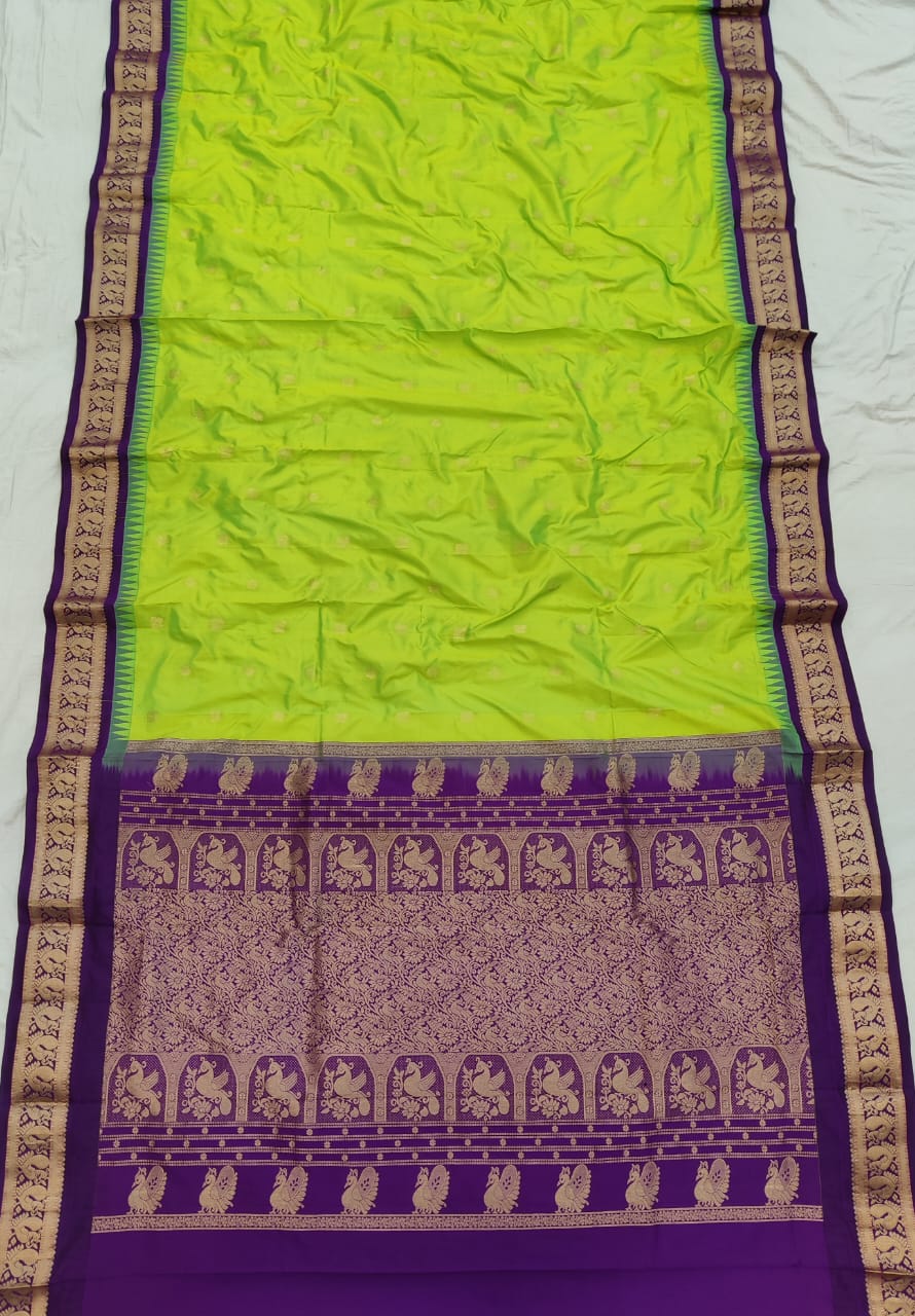 Lime Green silk Gadwal saree with purple border, peacock pallu and all-over butta