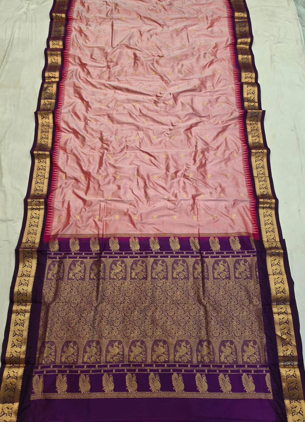 Onion Pink silk Gadwal saree with purple border, peacock pallu and all-over butta