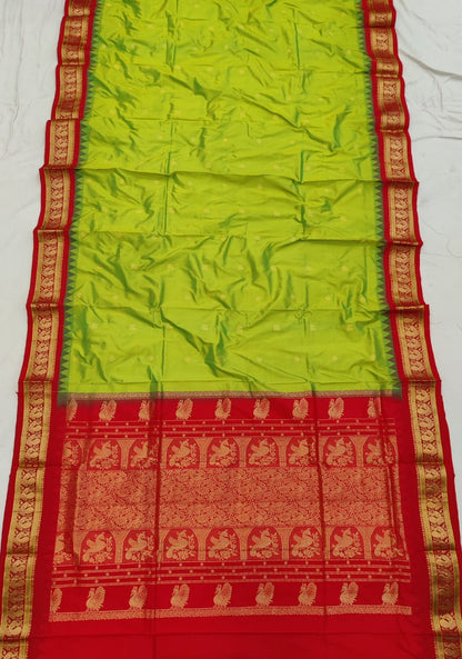 Parrot Green silk Gadwal saree with red border, peacock pallu and all-over butta