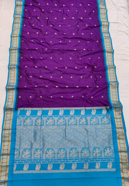 Purple silk Gadwal saree with sky blue border, peacock pallu and all-over butta